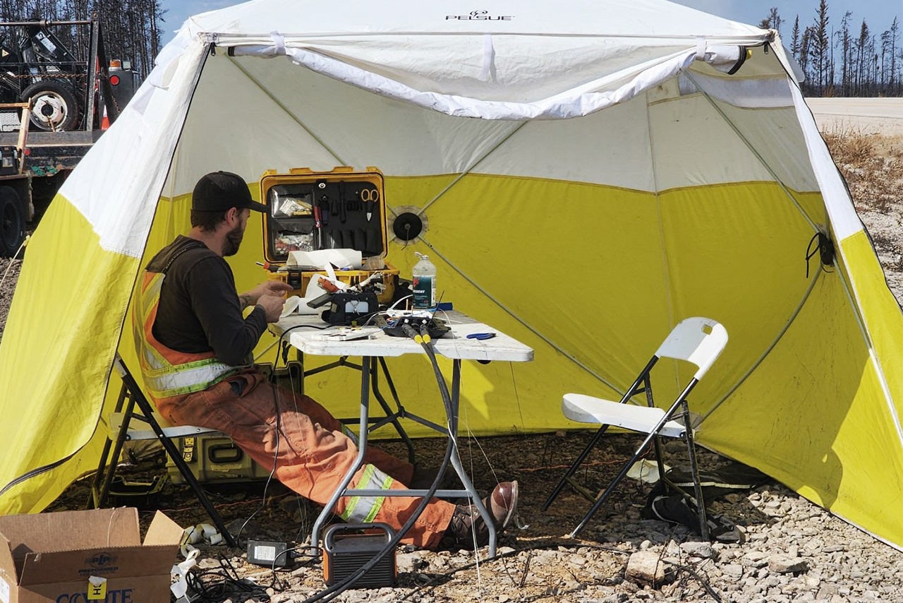 technician working in tent 