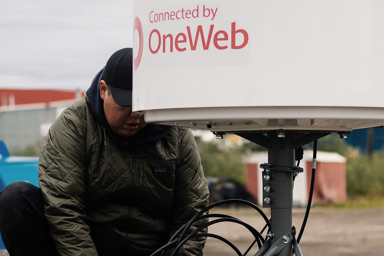 technician working on OneWeb satellite 