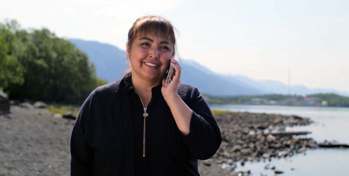 TRTFN Spokesperson Charmaine Thom talks on the phone while being filmed for our ‘Voices along the line’ video