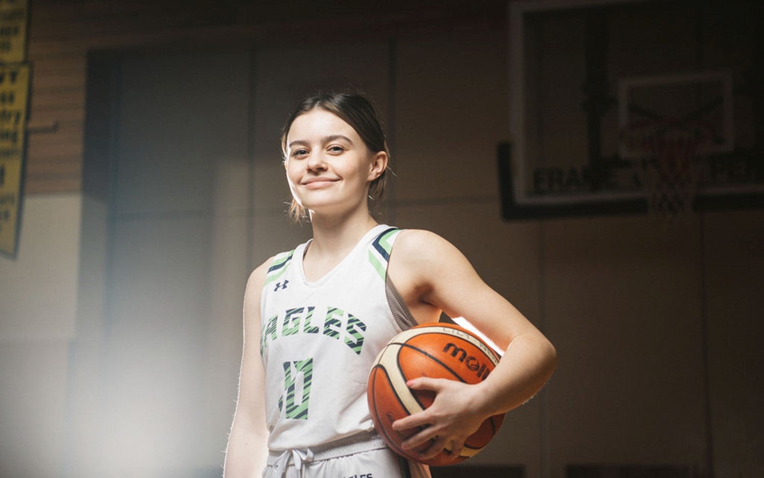 Lily proudly holds on to her basketball