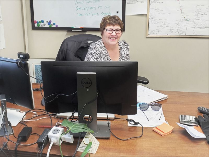 Sharon sitting in her Northwestel office