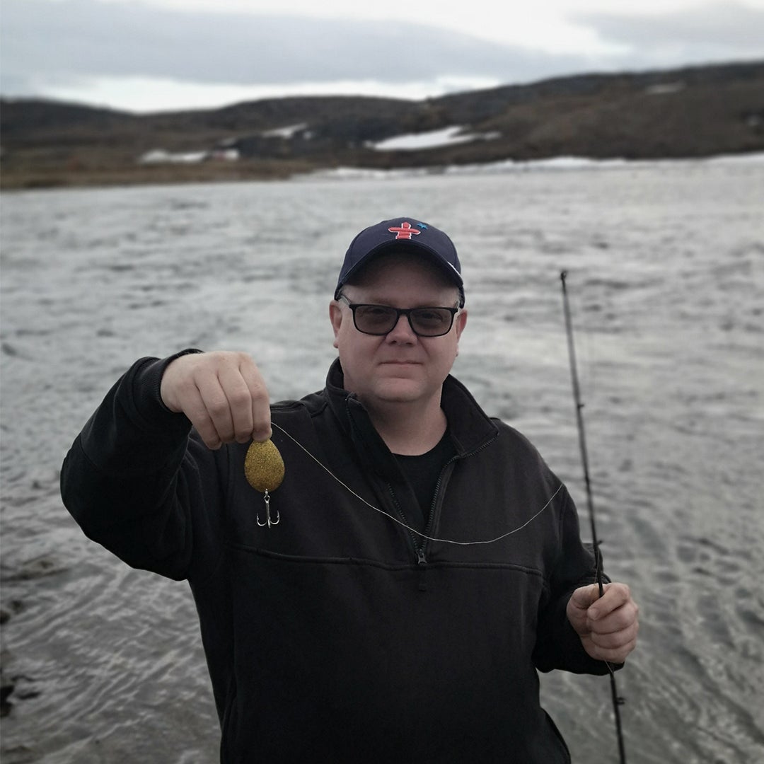 Man with fishing lure made of spoons 