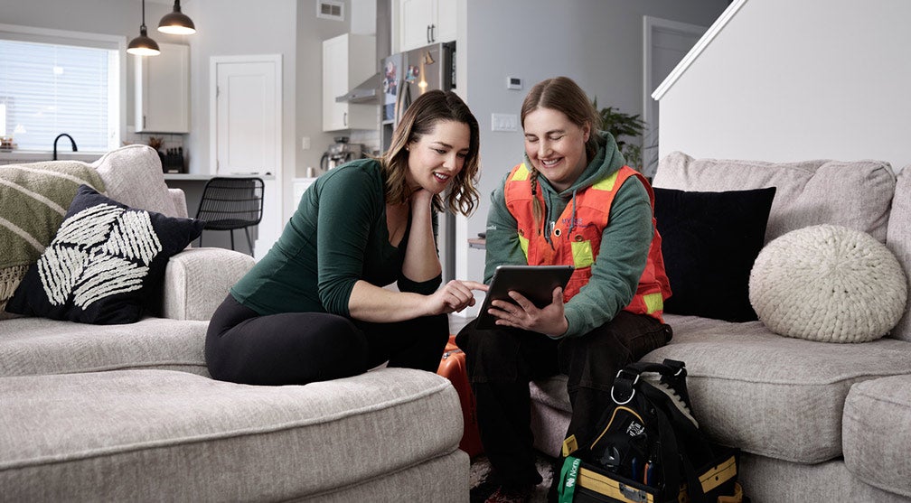 Female technician talking to customer about her new services with Northwestel