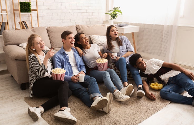 friends watching tv together