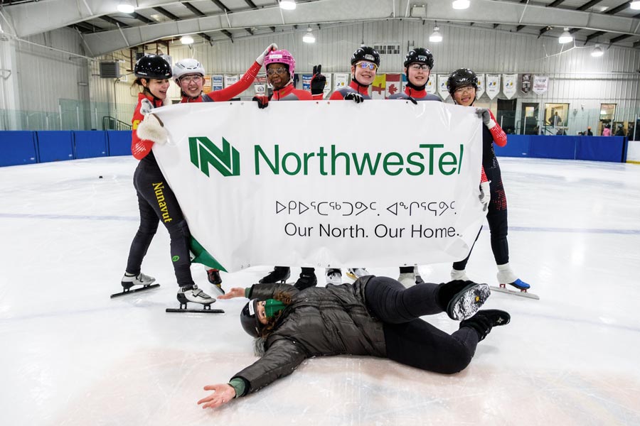 skating club together in front of banner