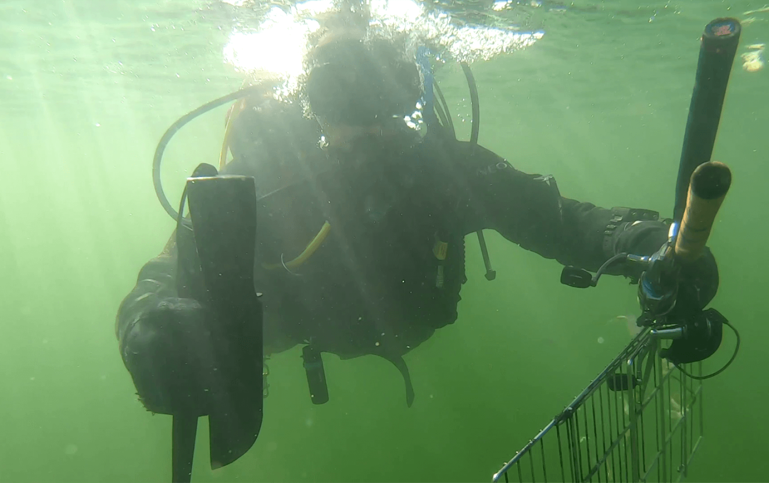 Diver underwater with find