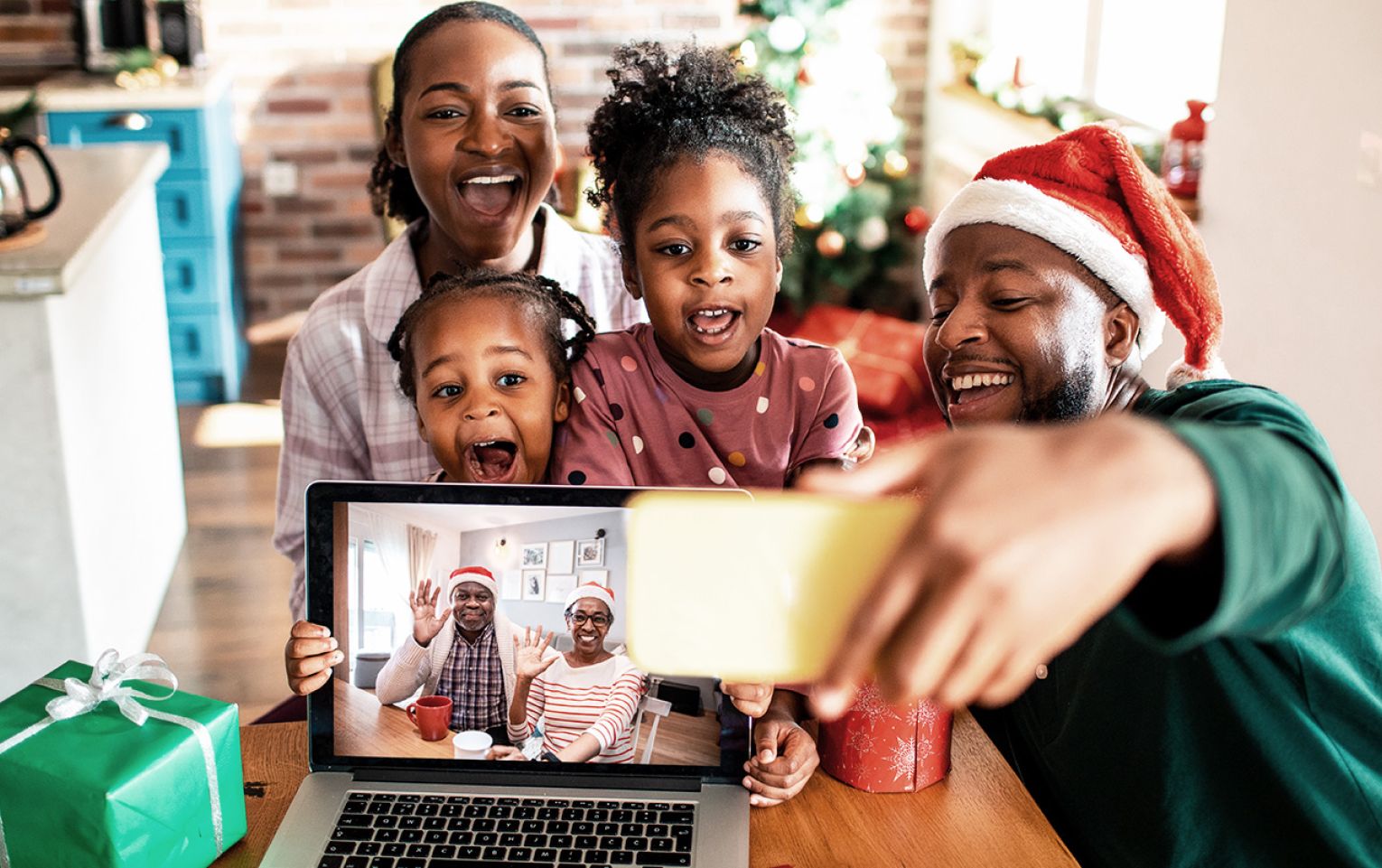 family using the Internet on phone and laptop