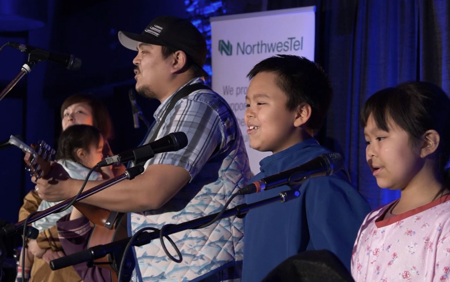 Indigenous singing performance with children singing in choir