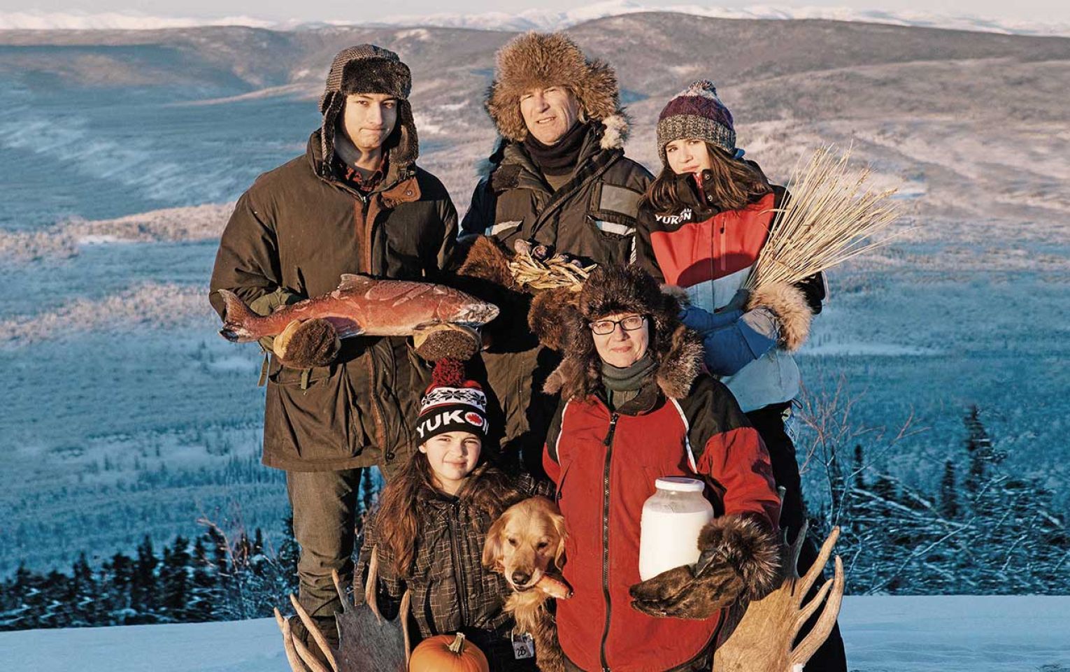 Suzanne Crocker and her family outside on a mountain in winter 