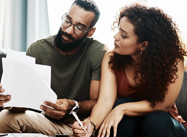 couple reading about price cap