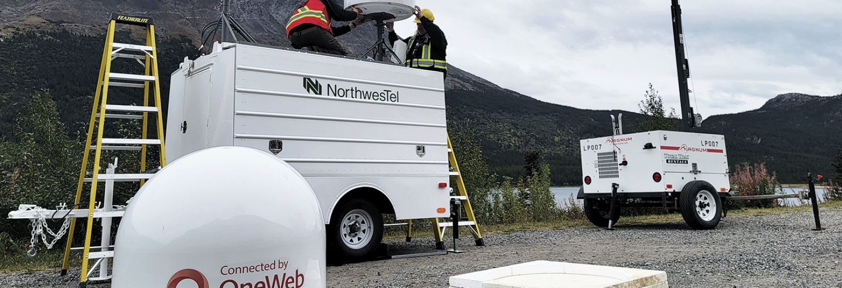 Tech's setting up OneWeb antennae at the Klondike Road Relay OneWeb antenna