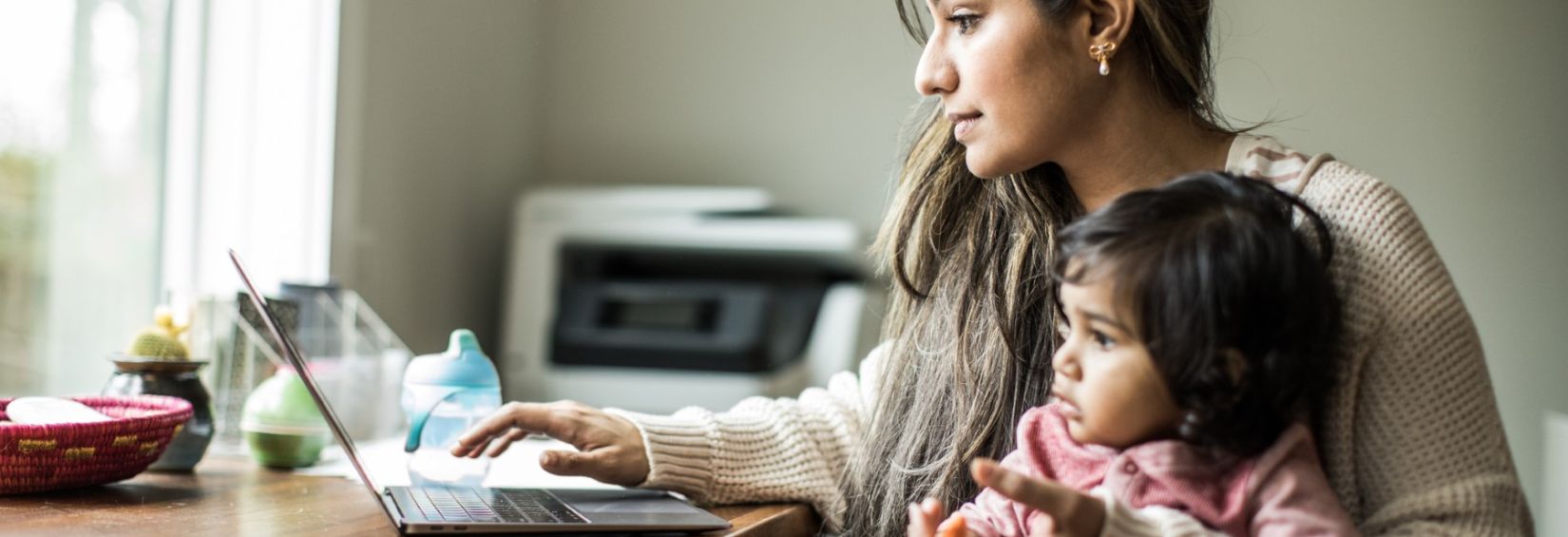 Woman using laptop at home