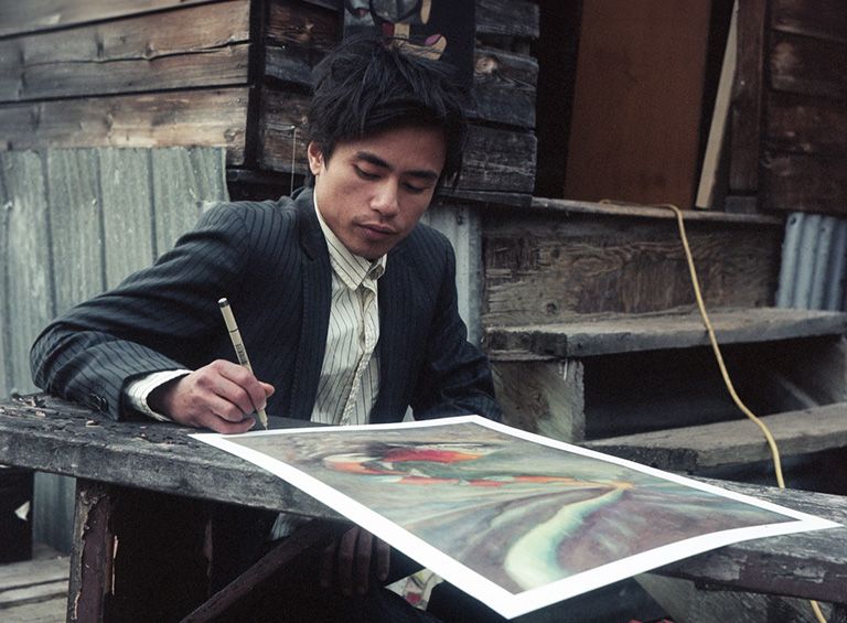 Ramon Joseph Santos signing his artwork, Salmon Aurora - as above, so below. Photography: Justin Apperley Ramon Joseph Santos signing his artwork, Salmon Aurora - as above, so below. Photography: Justin Apperley