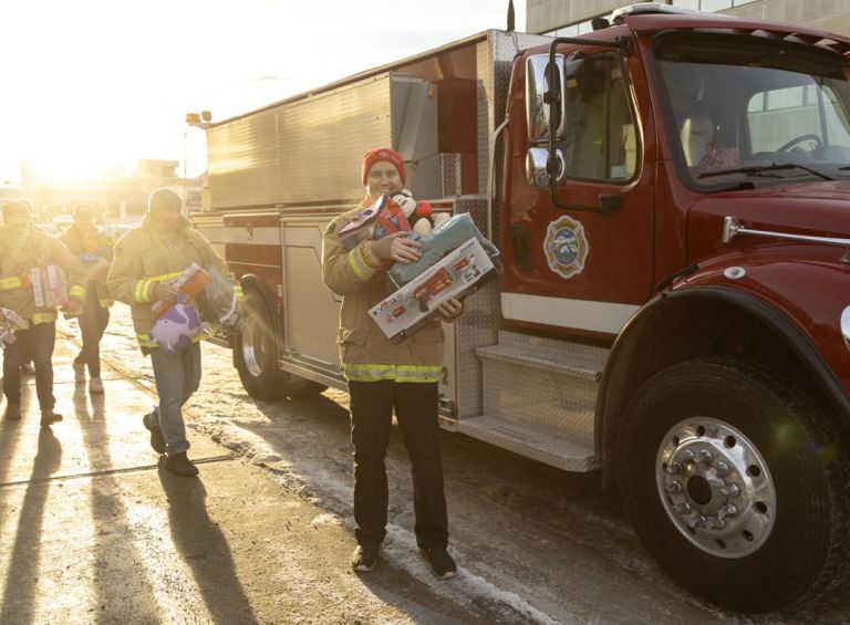 Nick standing in front of a fire truck