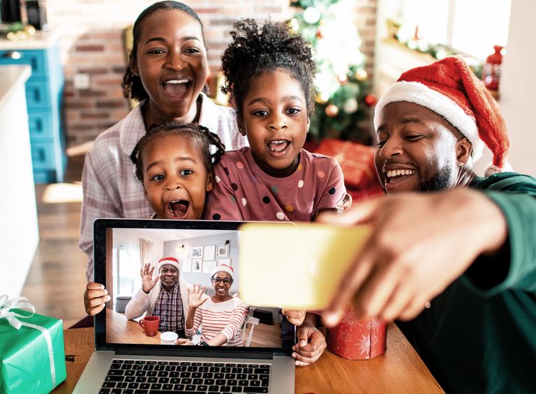 family using the Internet on phone and laptop